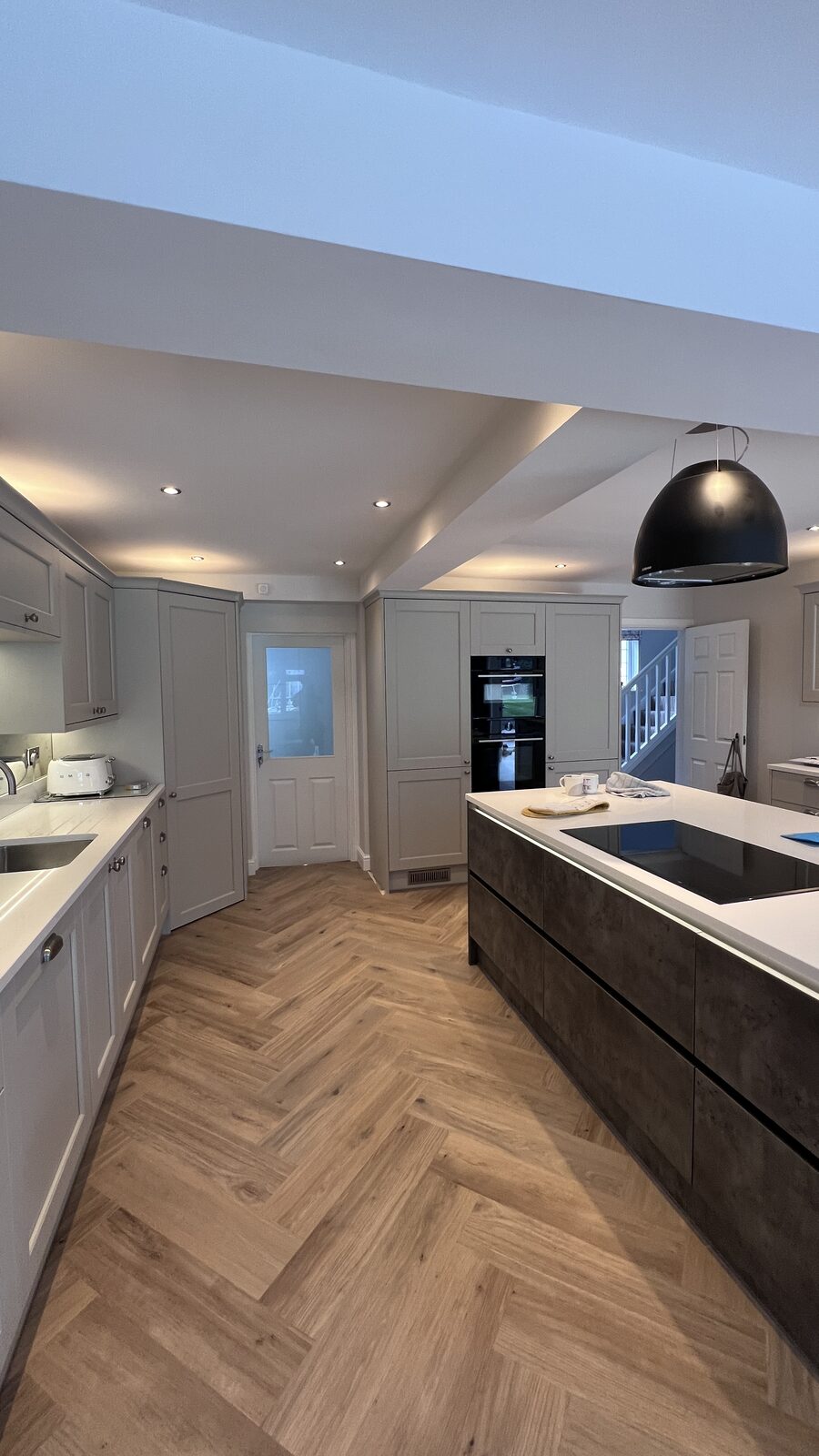 Shaker kitchen with island and herringbone floor